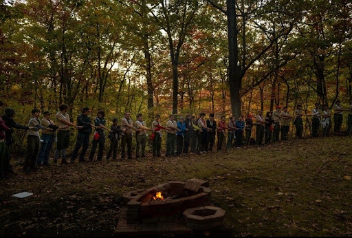 A group of Arrowmen linking hands