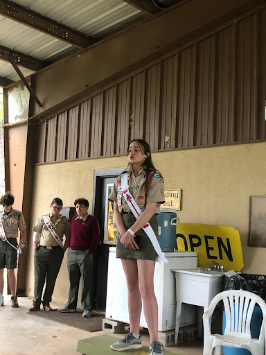 Arrowman on stand giving speech